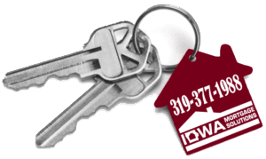 House keys on a red Iowa Mortgage Solutions key tag showing 319-377-1988